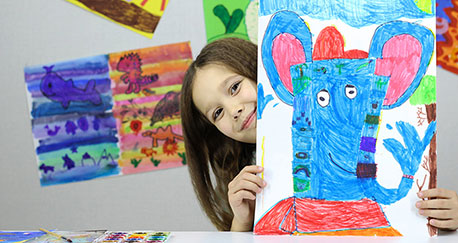 Girl enjoying after school program sponsored by Consumers Energy